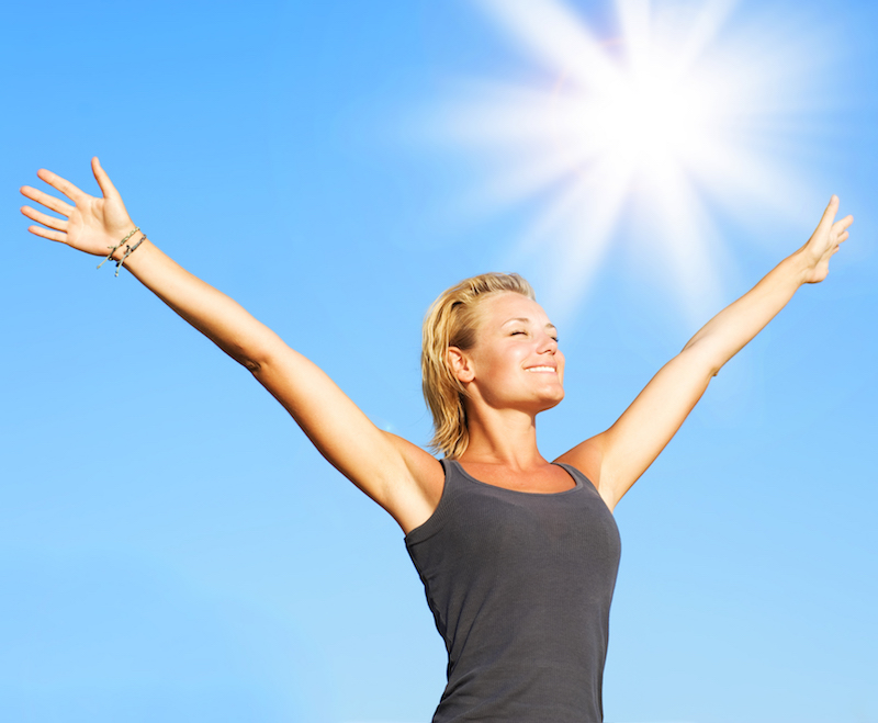 Healthy Young Woman Over Blue Sky