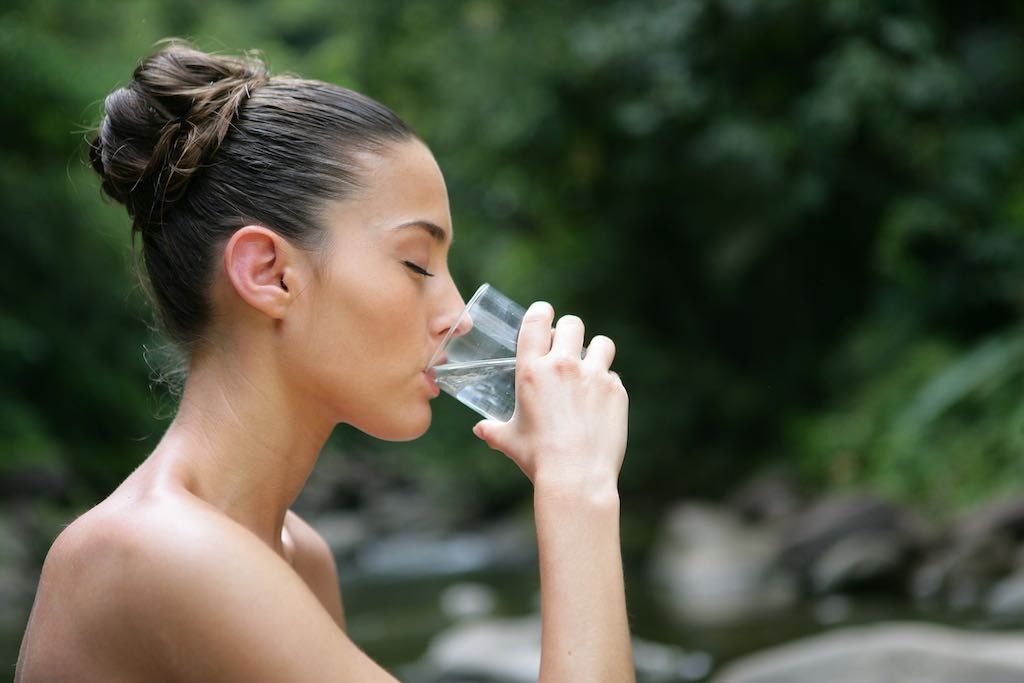 Lady drinking water from a glass